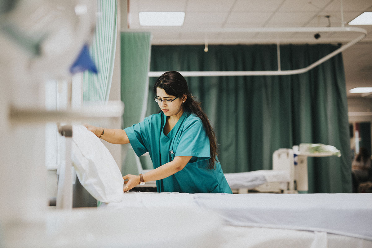 nurse making bed